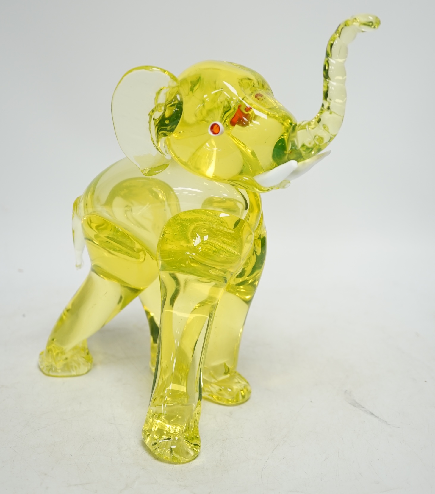 A Murano uranium glass model of an elephant, 26cm. Condition - good.